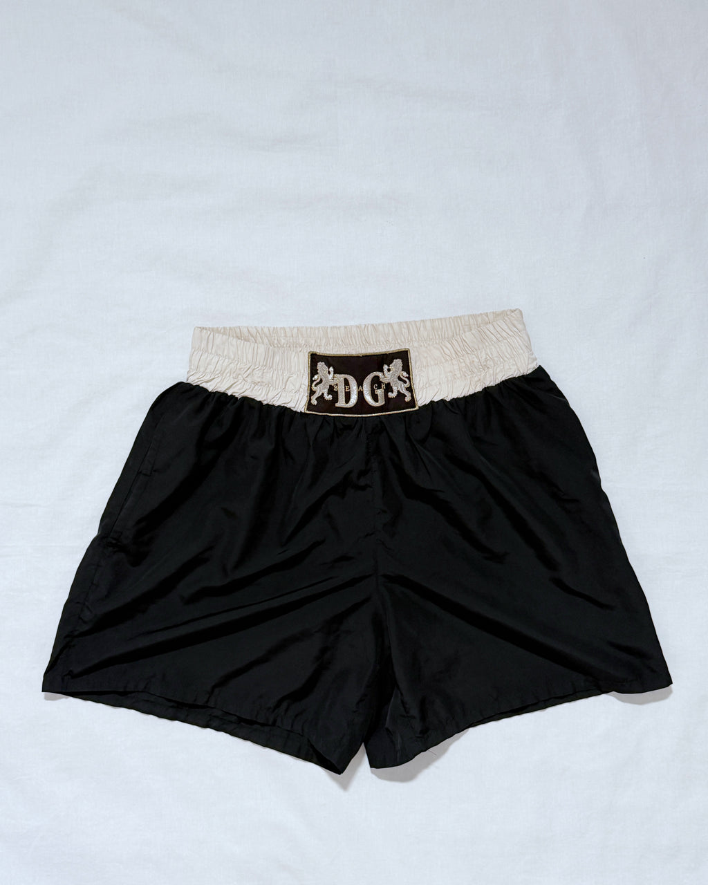 Front view of vintage Dolce & Gabbana boxing short, black and cream polyester, size M