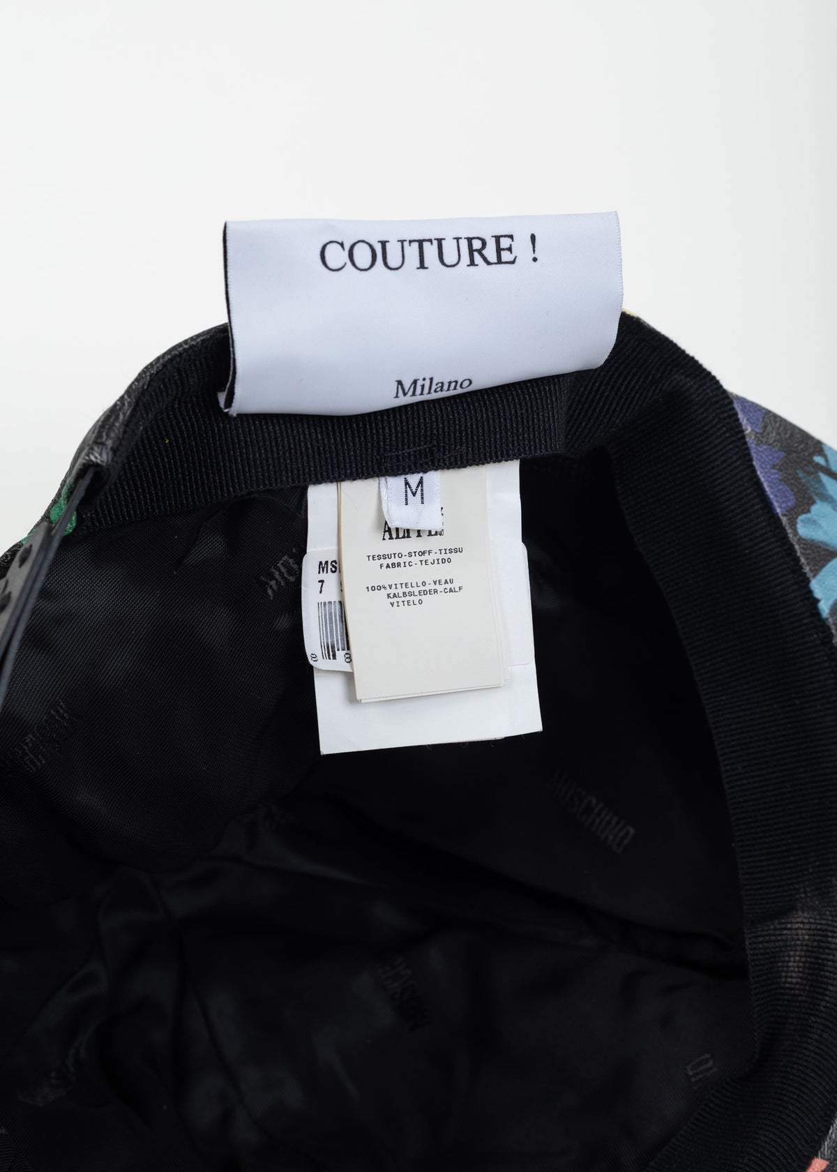 Interior labels reading Couture! Milano, size M and 100% calf leather