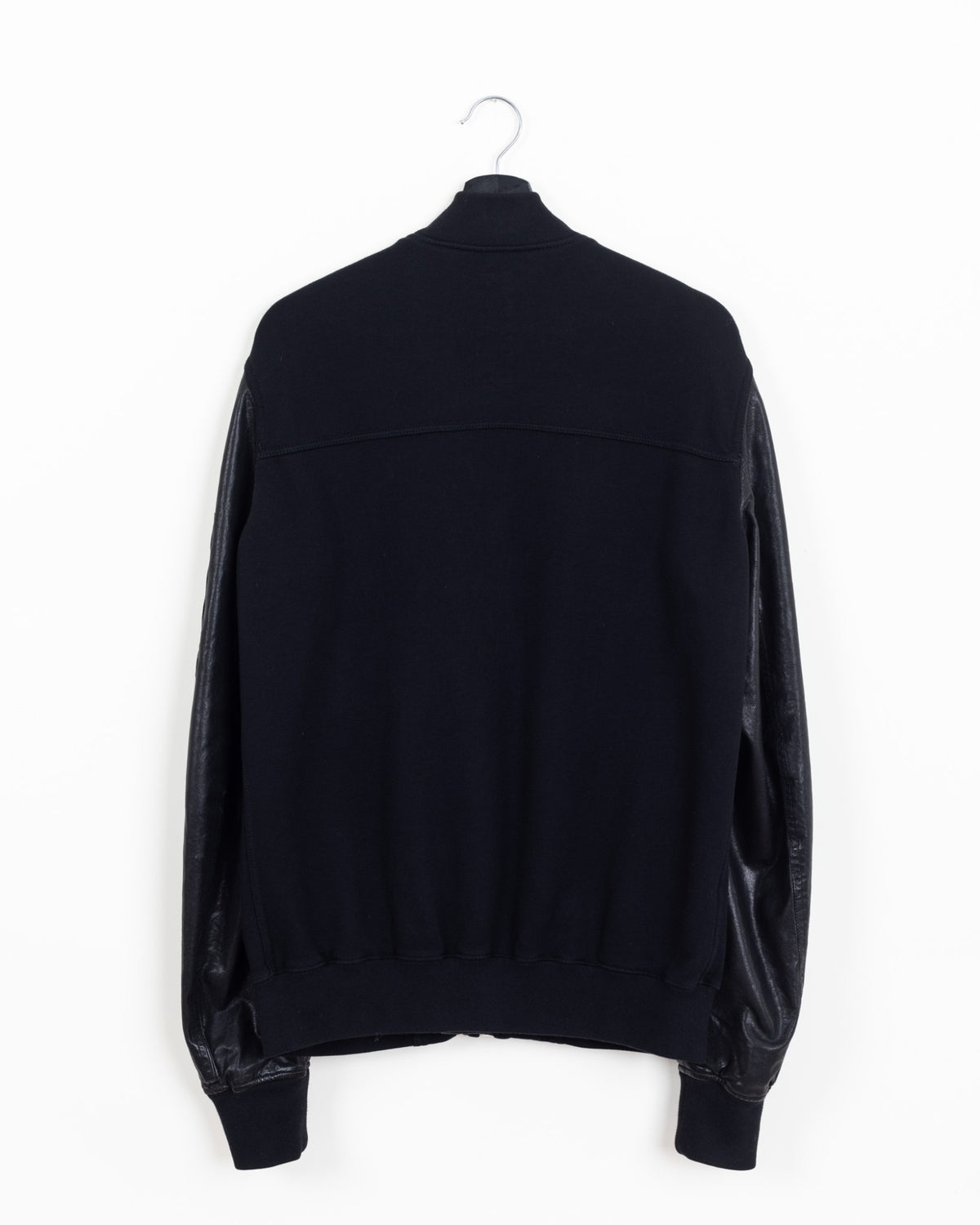 Rick Owens DRKSHDW MA-1 bomber, back view showing black cotton fleece body with yoke seam, leather sleeves and ribbed waistband