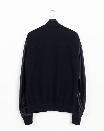 Rick Owens DRKSHDW MA-1 bomber, back view showing black cotton fleece body with yoke seam, leather sleeves and ribbed waistband